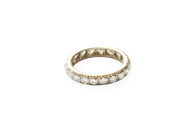 Lot 323 - A Diamond Eternity Ring, the round brilliant...