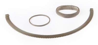 Lot 1061 - A Mesh Necklace, Bracelet and Bangle, by...