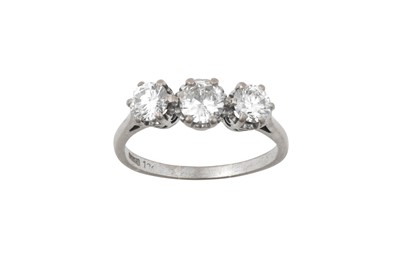 Lot 2165 - A Diamond Three Stone Ring the graduated round...