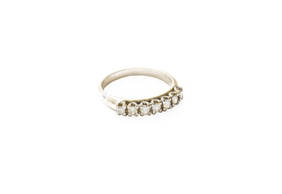 Lot 310 - A Diamond Seven Stone Ring, the round...