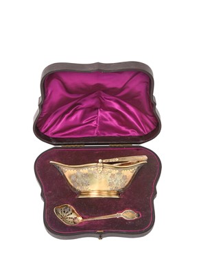 Lot 2324 - A Cased Victorian Silver-Gilt Basket and Sifting-Spoon