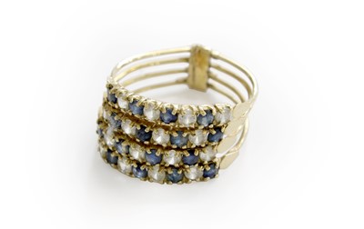 Lot 239 - A Sapphire and Cubic Zirconia Stacking Ring,...