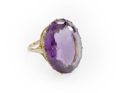 Lot 202 - An Amethyst Ring, the oval cut amethyst in a...