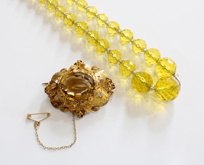 Lot 204 - A Citrine Brooch, the oval cut citrine in a...