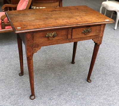 Lot 1352 - A Georgian Oak Two Drawer Side Table, with...