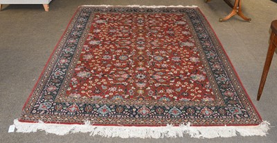 Lot 1184 - Indian Carpet, the deep terracotta field of...