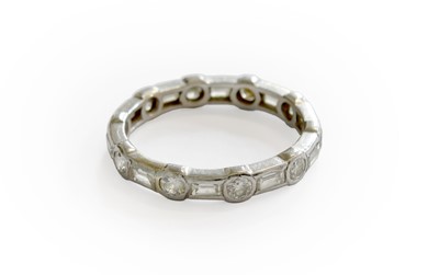 Lot 261 - A Diamond Eternity Ring, round brilliant cut...