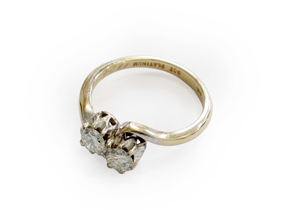 Lot 203 - A Diamond Two Stone Twist Ring, the round...