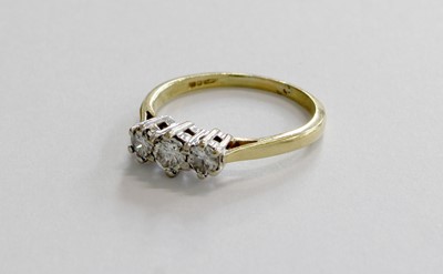 Lot 258 - An 18 Carat Gold Diamond Three Stone Ring, the...