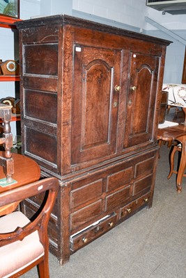 Lot 1243 - An 18th Century Oak Cupboard, moulded cornice...