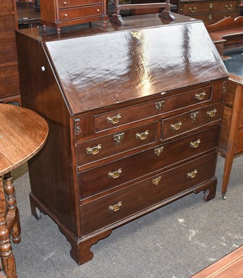 Lot 1283 - A George III Mahogany Bureau, with break front...