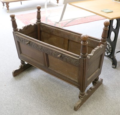 Lot 1253 - A Childs Oak Crib, with panel sides, composed...