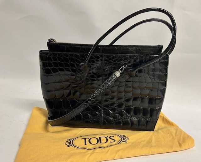 Lot 1033 - Tods Black Patent Leather Crocodile Look...