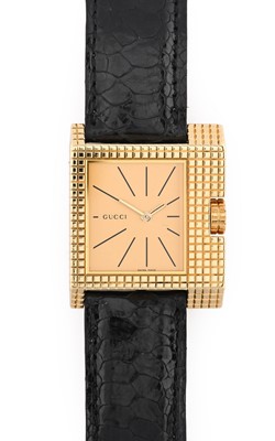 Lot 2501 - Gucci: An 18 Carat Gold Wristwatch, signed...