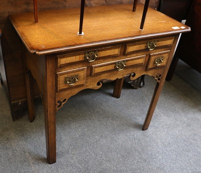 Lot 1211 - A Reproduction Oak Lowboy, in George III style,...