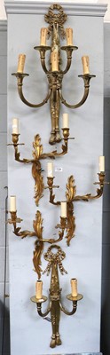 Lot 1144 - A Set of Three Gilt Metal Twin Light Wall...