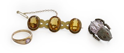 Lot 240 - A Citrine Brooch, three oval cut citrines in...