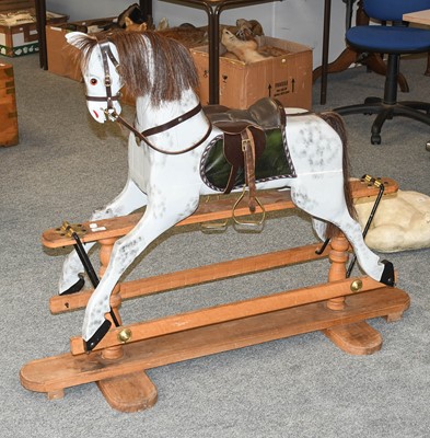 Lot 1267 - A Painted Wooden Rocking Horse, on trestle...