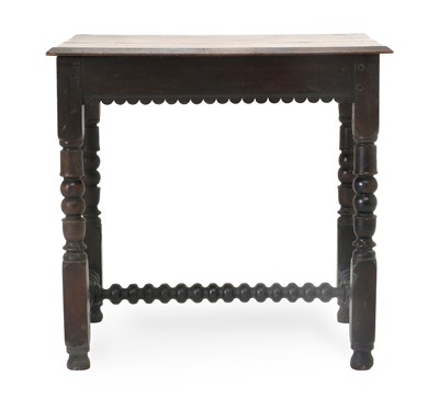 Lot 611 - An Oak Side Table, the moulded top above a...