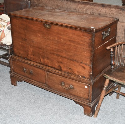 Lot 1319 - A George III Elm Mule Chest, raised on two...