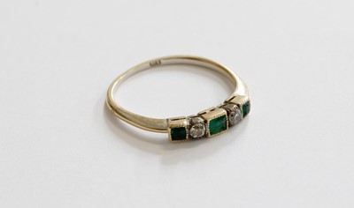 Lot 231 - An Emerald and Diamond Five Stone Ring, three...