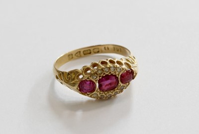 Lot 243 - An 18 Carat Gold Ruby and Diamond Ring, three...