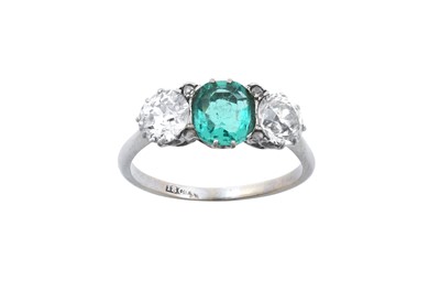 Lot 2206 - An Emerald and Diamond Three Stone Ring the...