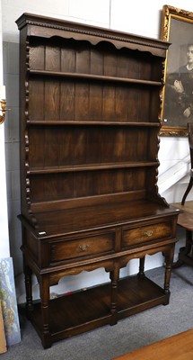 Lot 1145 - A Reproduction Oak Dresser and Rack, the...