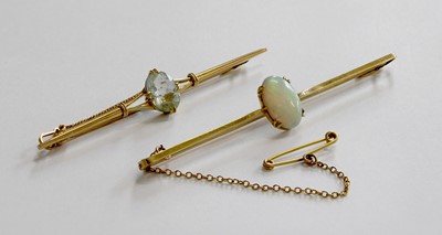 Lot 301 - An Opal Bar Brooch, the oval cabochon opal in...