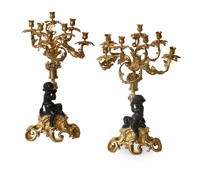Lot A Pair of French Gilt and Patinated Bronze...