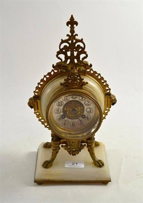 Lot 21 - A late 19th century French gilt metal and white marble mantel clock in a circular case