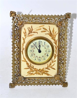 Lot 39 - Brass and pottery mantel clock on an easel frame