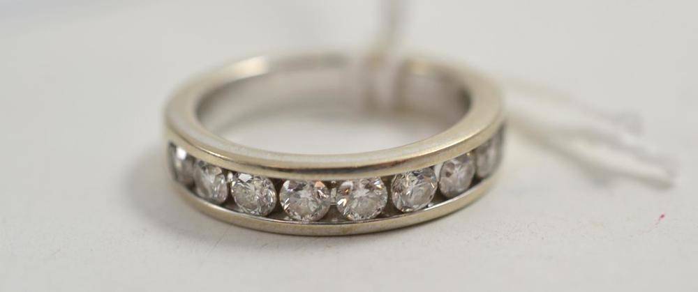 Lot 57 - An 18ct white gold diamond half eternity ring, total estimated diamond weight 0.90 carat...