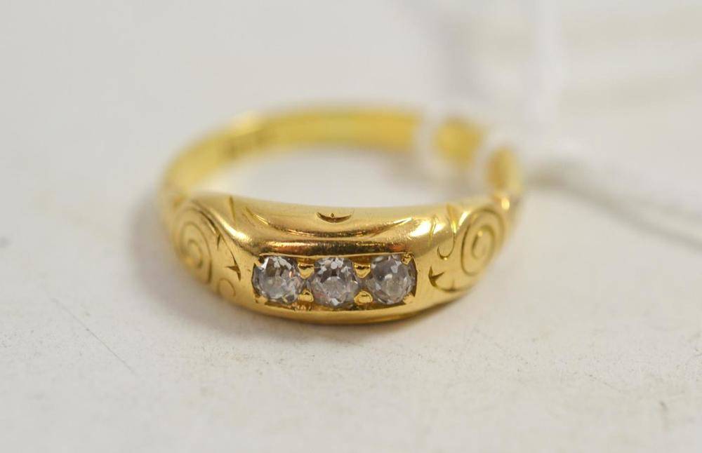 Lot 70 - A Victorian diamond three stone ring, stamped '18CT'