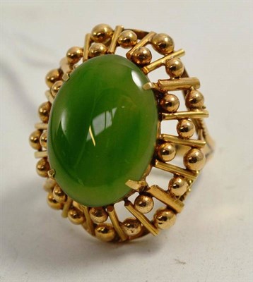 Lot 80 - A jade-type ring, stamped '18k'