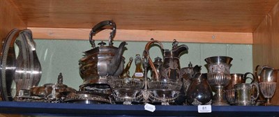 Lot 81 - Shelf of plated wares including spirit kettle on stand, two handled tray, goblets etc