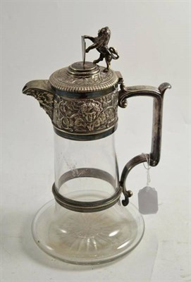 Lot 101 - A glass claret jug with plated mounts