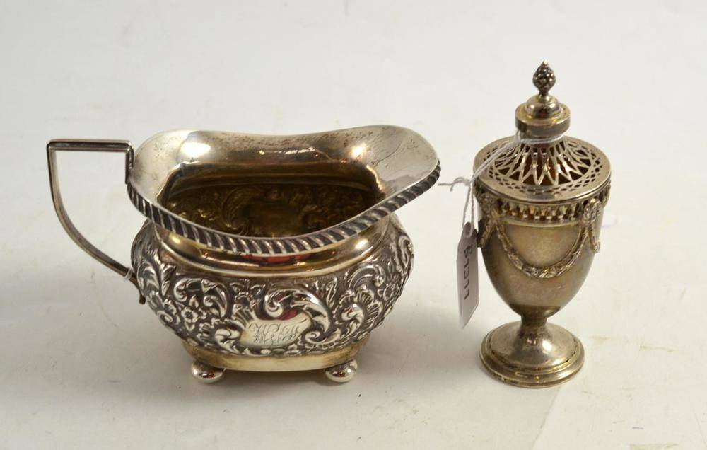 Lot 102 - Embossed silver cream jug, Birmingham 1905 makers mark J G;  and Classical style pedestal condiment