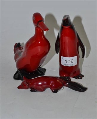 Lot 106 - A Royal Doulton flambé penguin, fox and duck (3)