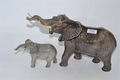 Lot 131 - Two Beswick elephants (trunk stretching) - large and small