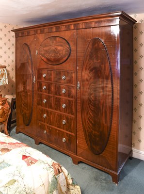 Lot 1301 - An Edwardian Mahogany Triple-Door Wardrobe,...
