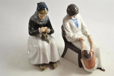 Lot 138 - A B & G figure of mother and child and a Royal Copenhagen figure of a woman darning (2)