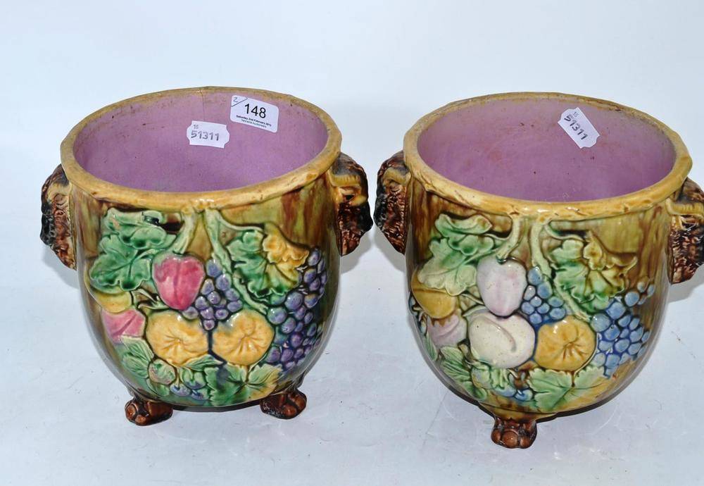 Lot 148 - Pair of Majolica jardinieres with rams head handles on claw feet