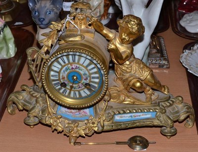 Lot 152 - Gilt metal figural mantel clock with porcelain plaque inserts and pendulum
