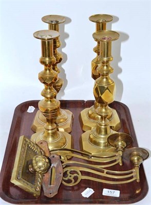 Lot 157 - Two pairs of brass candlesticks, pair of brass sconces and brass wall mounted lever handle