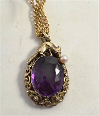 Lot 173 - A fox motif pendant with amethyst and cultured pearl detail, on a long length chain, with...