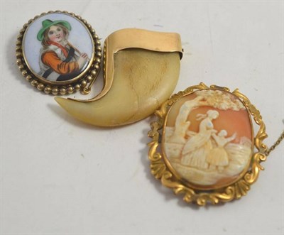 Lot 176 - A 14ct gold mounted tiger's claw watch fob with engraved decoration, 5cm long, a cameo brooch...