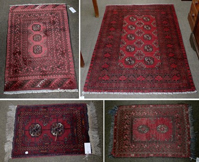 Lot 1108 - Afghan Turkmen Rug, the claret field with two...