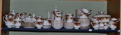 Lot 184 - A Royal Albert 'Old Country Roses' tea and dinner service displayed on a shelf
