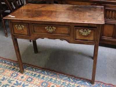 Lot 1175 - A George III Three Drawer Lowboy, banded in...